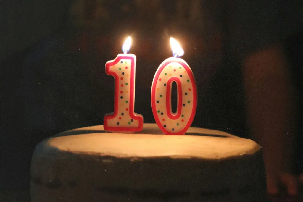 "10" candle lit on a cake
