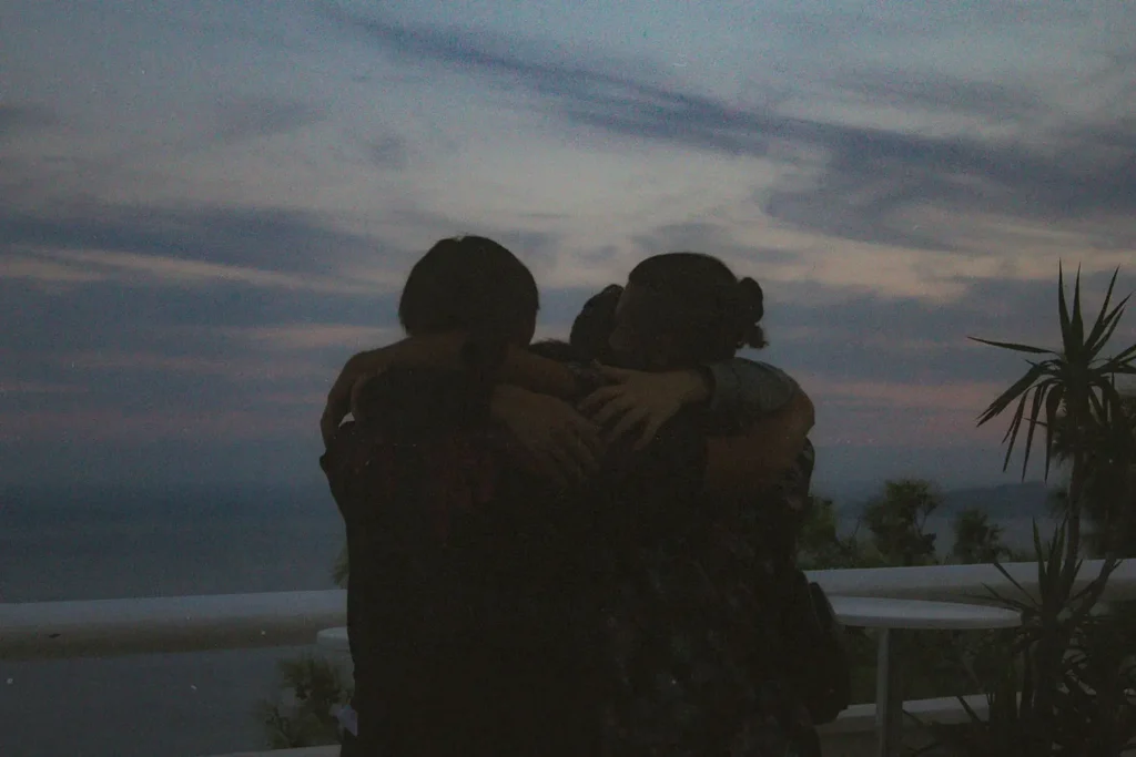 Group of people hugging each other