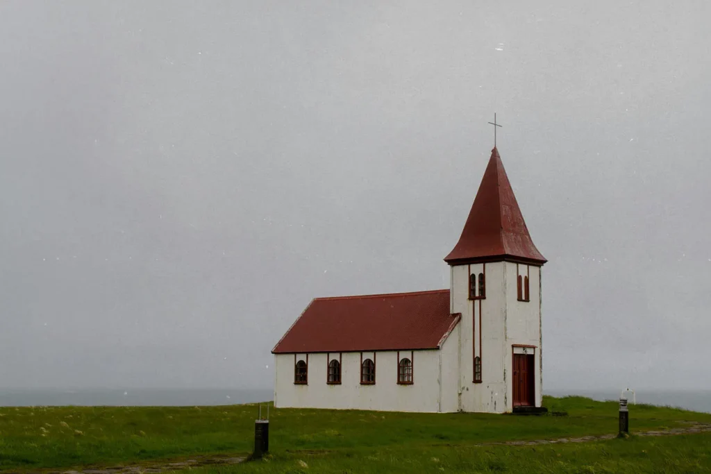 20171023-4-Ways-to-Grow-in-Your-Faith-KCM-Blog - KCM Blog older white church with red roof in the middle of a field