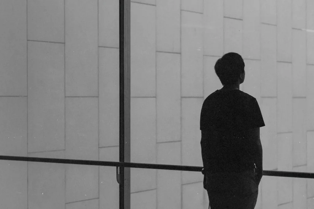 What-Is-the-True-Meaning-of-Great-Faith-KCM - KCM Blog Single man standing at a glass window