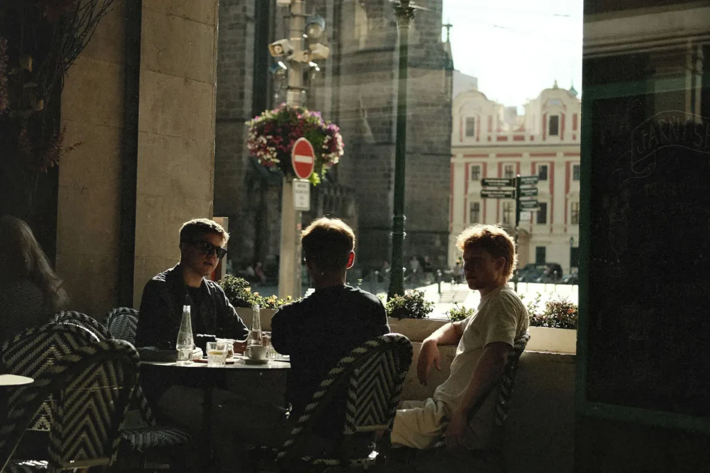 Group of men sitting at outdoor cafe