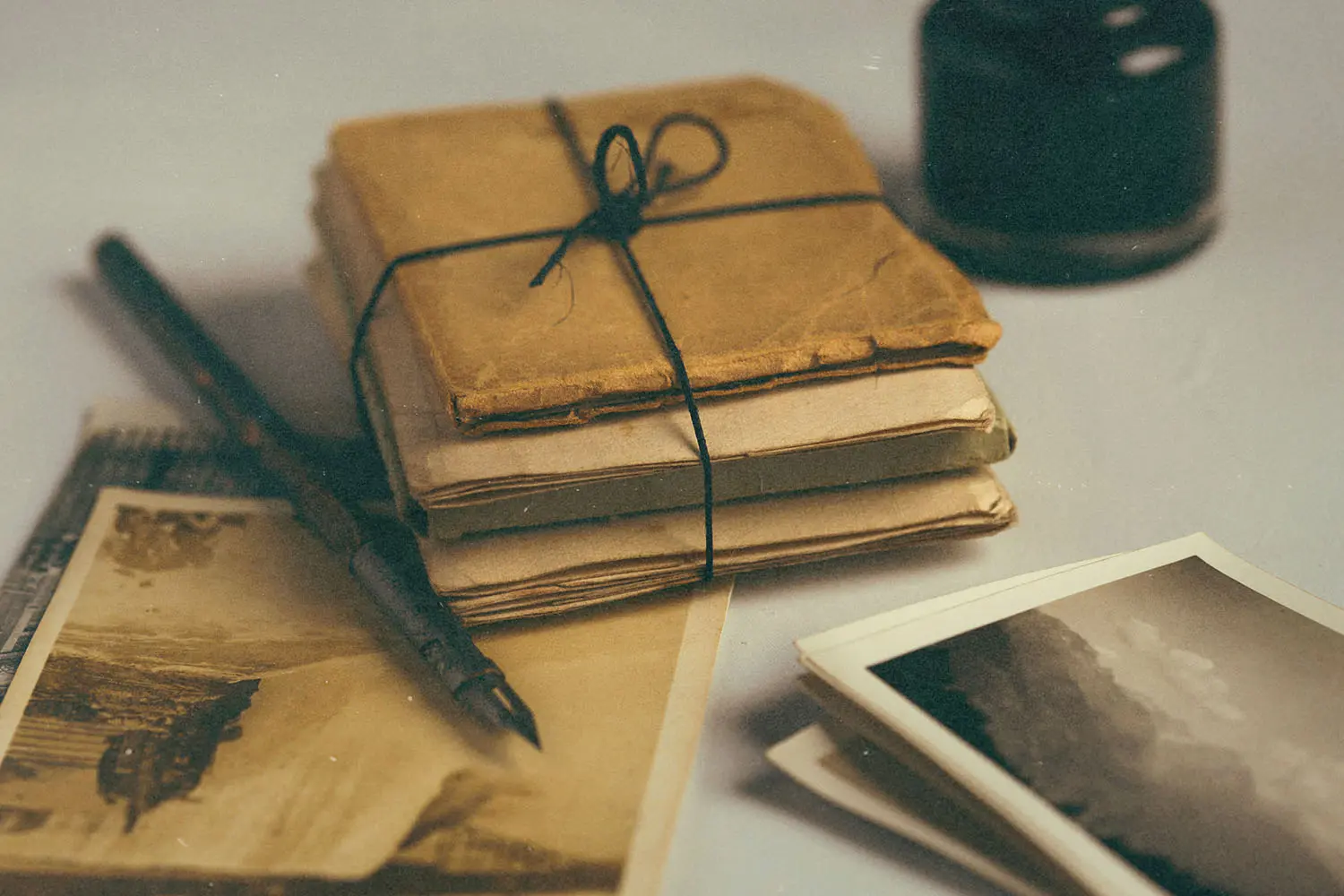 stack of envelopes tied with a string
