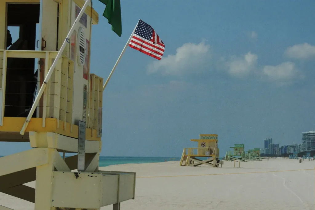 Lifeguard stand on the beach with an American flag flying
