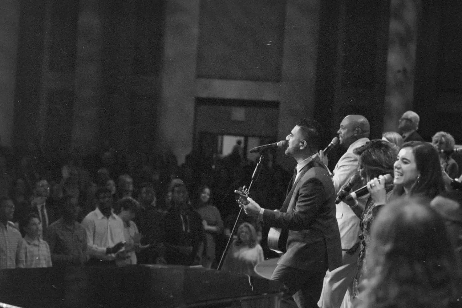 EMIC Worship team leading worship in front of congregation