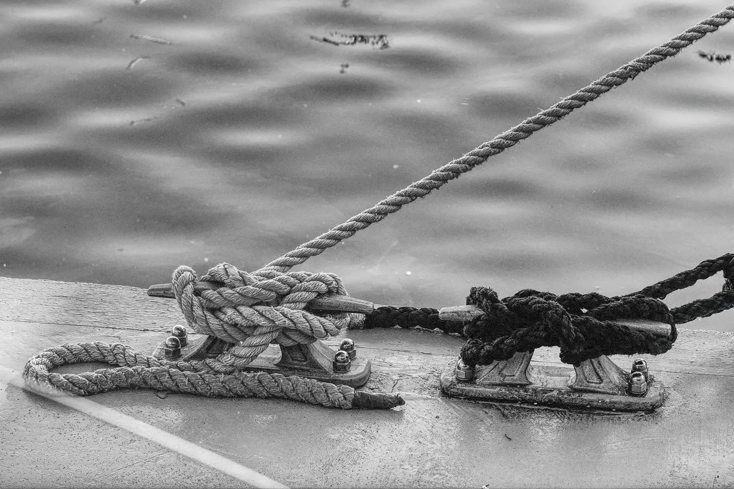 black and white photo boat tied off