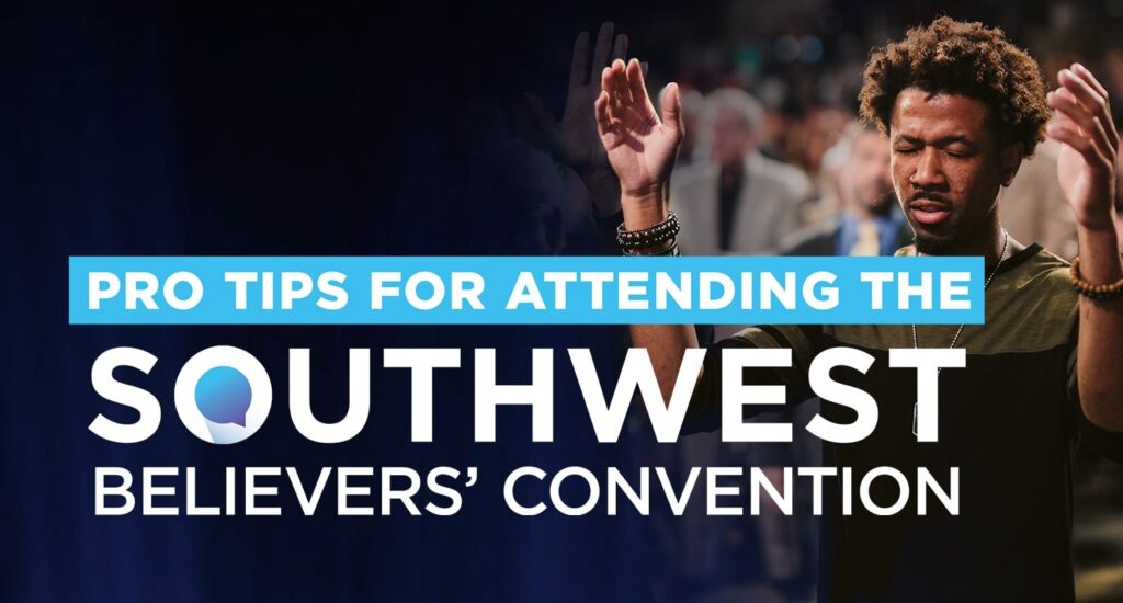 An image of a young man in a church service with hands raised submitting to God during worship