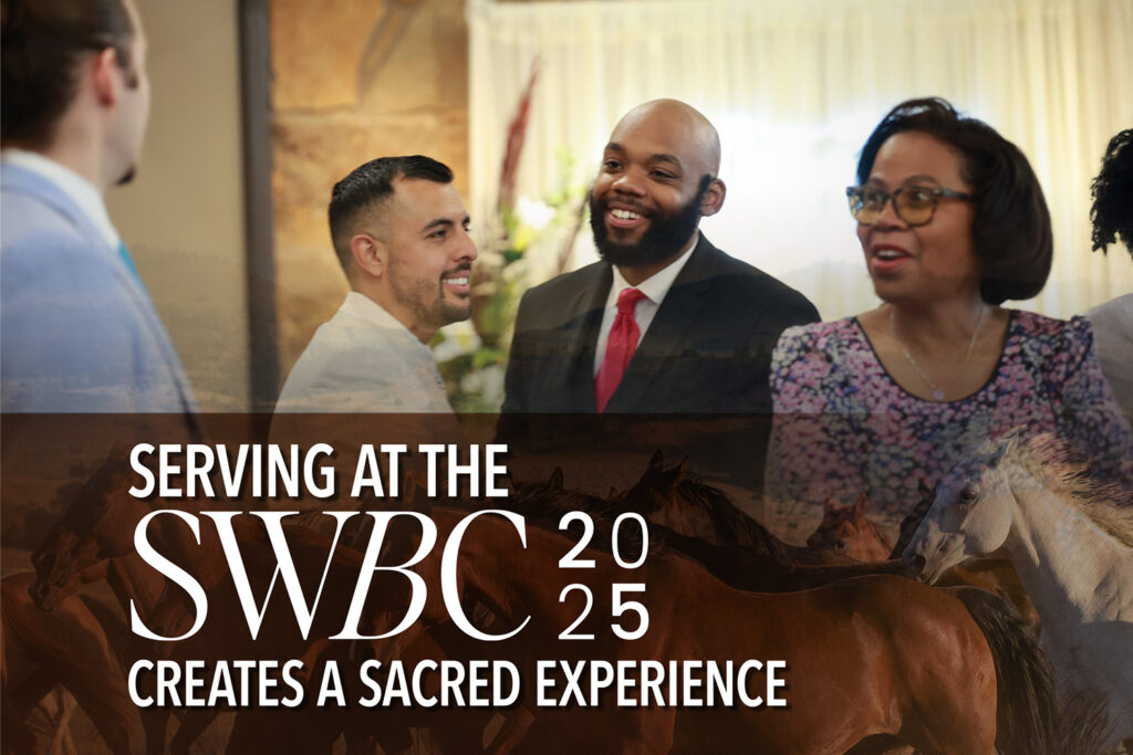 A group of people laughing together in a church lobby
