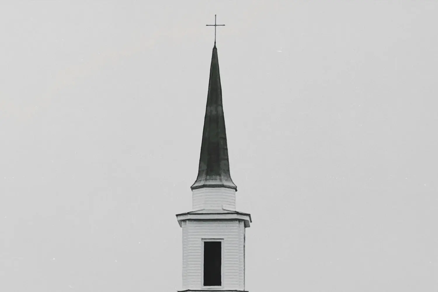 Church steeple with a cross on the top