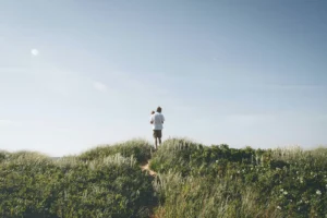 father holding his son in a field of grass