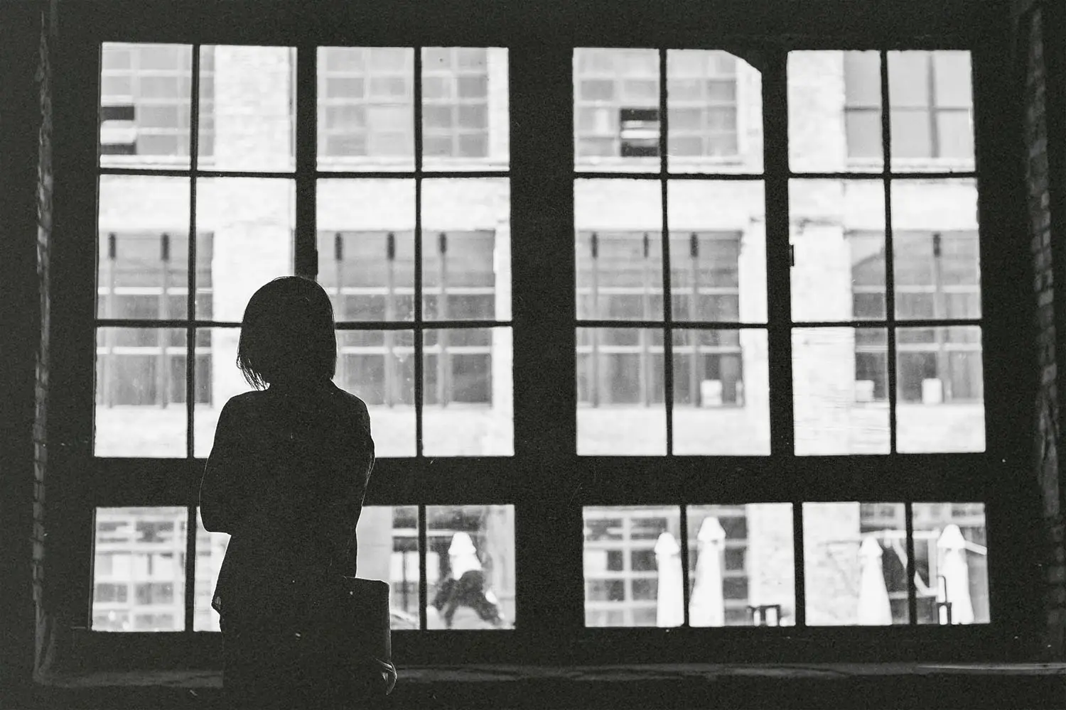 Woman looking out loft window