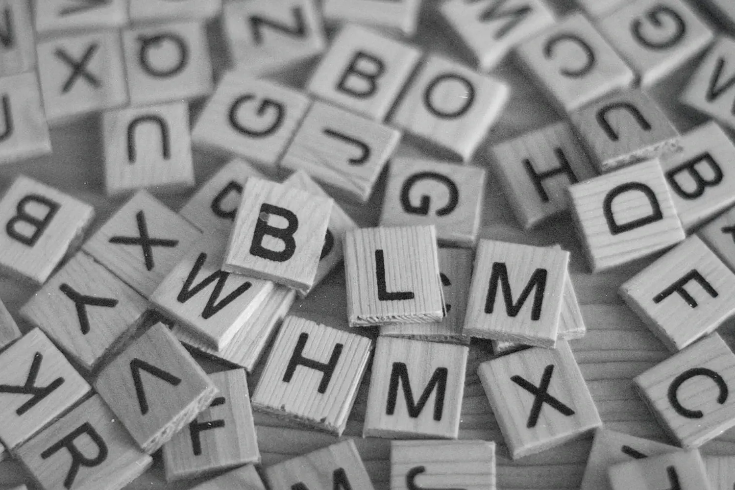 Pile of wooden tiles with Alphabet letters