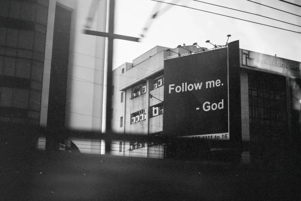 Sign that says "Follow Me. - God"