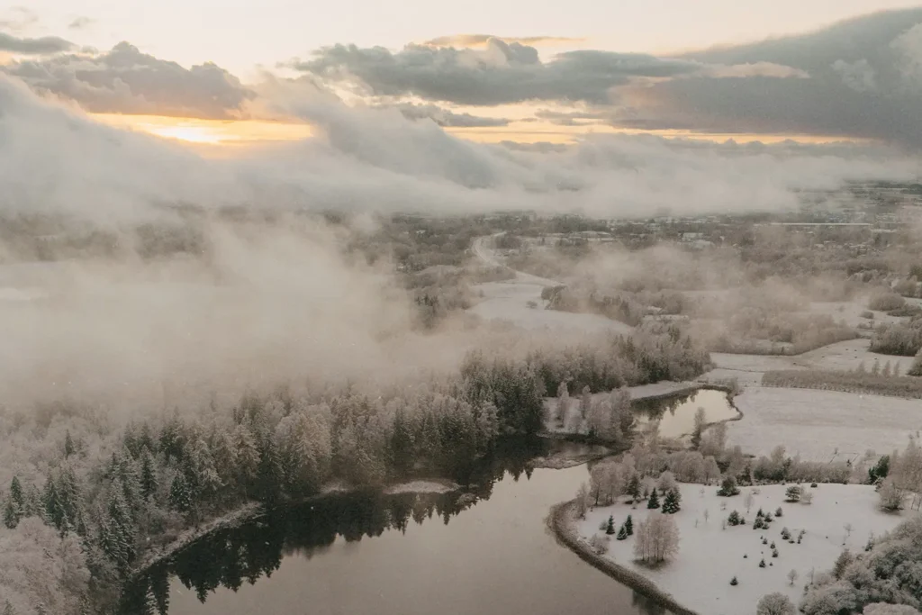 snowy river with fog