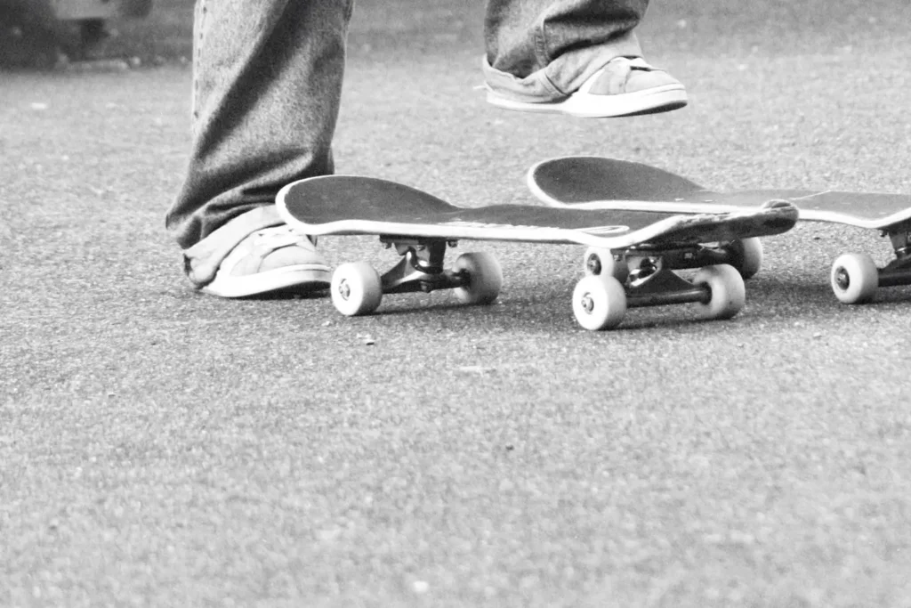 20230117-Unshakable-6-Ways-To-Live-Fear-Free-KCM-Blog - KCM Blog Two legs lifted above 2 skateboards