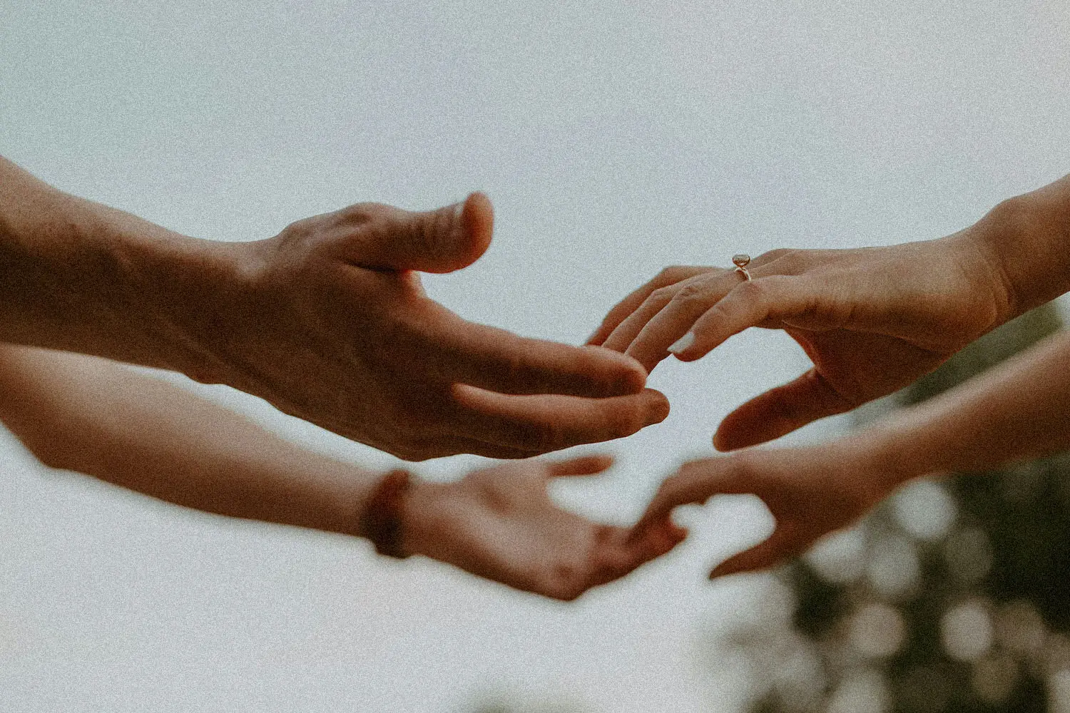 man and woman holding hands