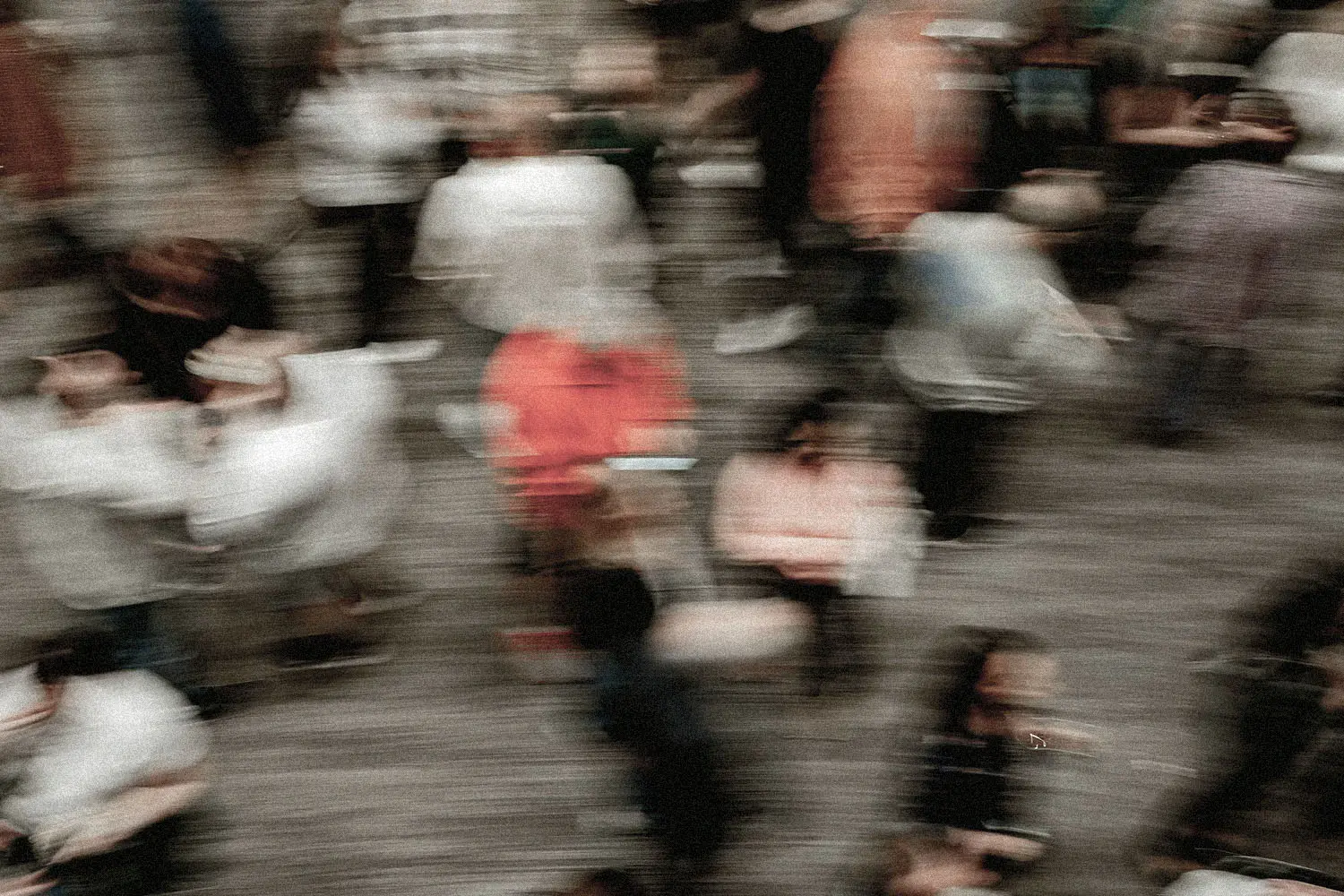 Blurred image of crowd of people walking