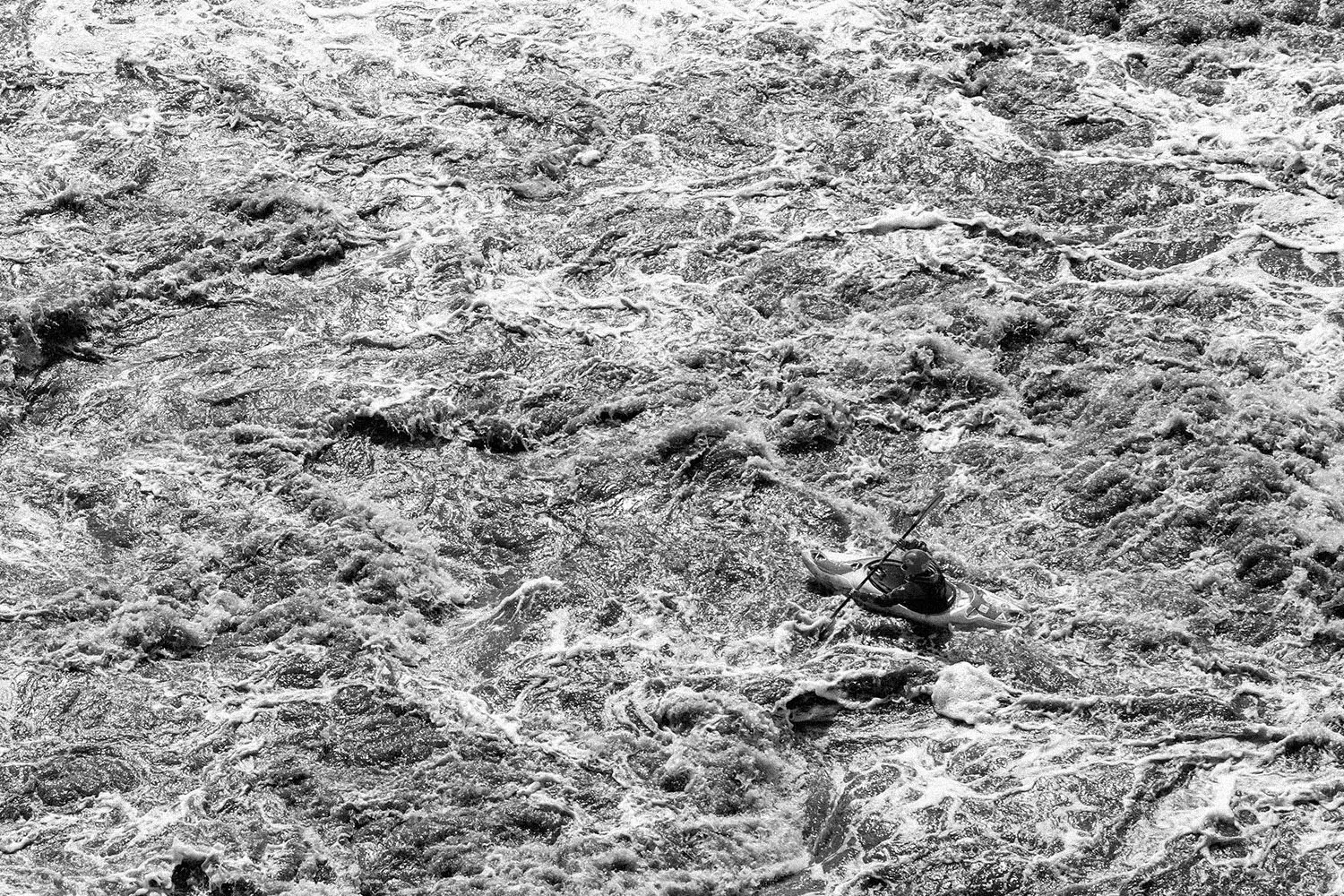 Kayak in the middle of rushing waters