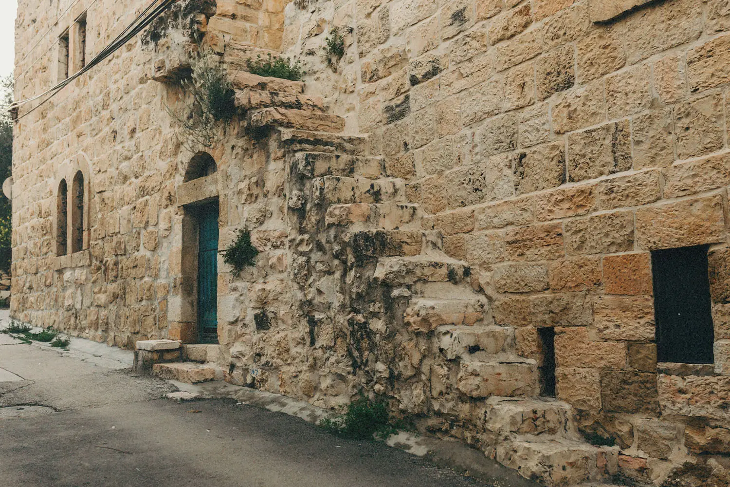 Limestone steps on the side of building