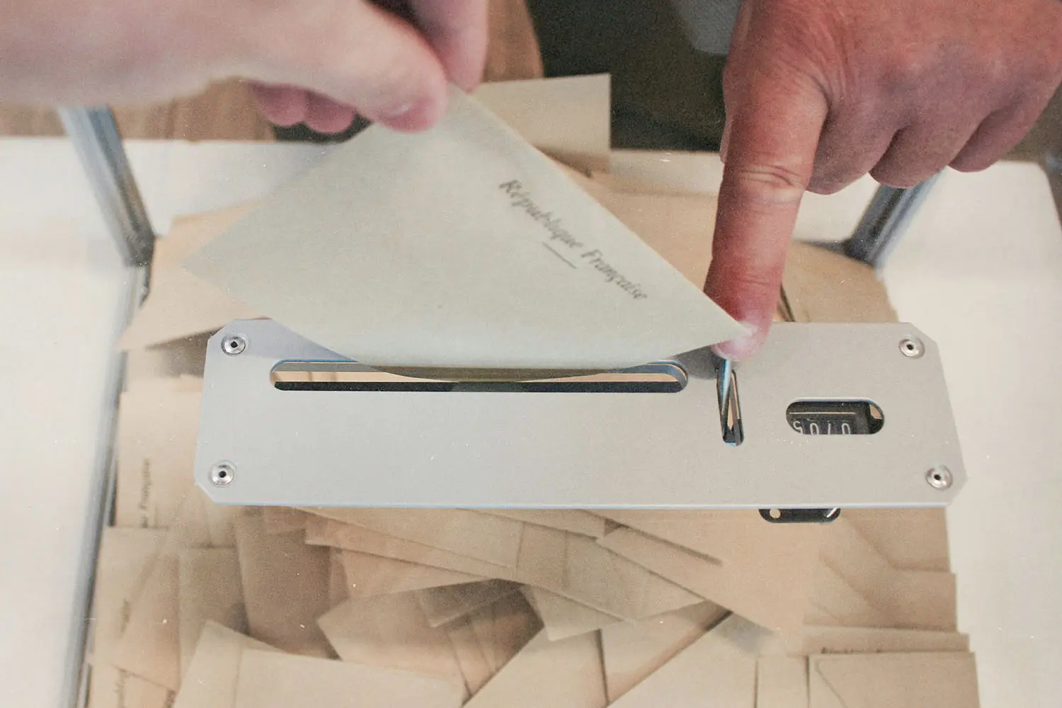 Hand holding a voting ballot