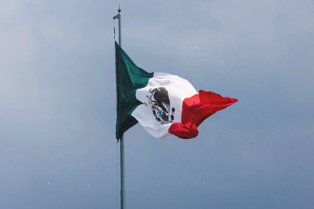 20250227-Feeding-Children-in-Mexico-KCM-Blog - KCM Blog Mexico flag flying with clear sky in the background