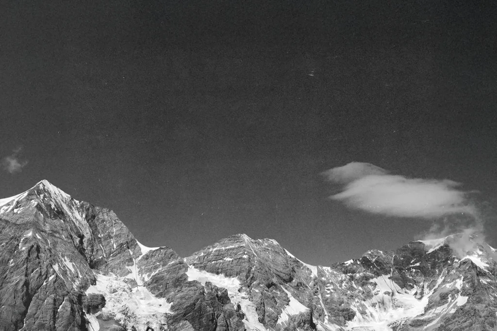 Black and white image of snowy mountain peaks
