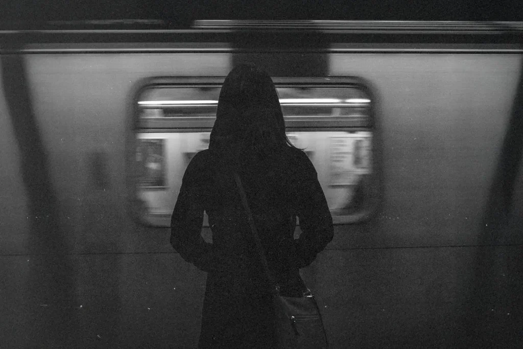 woman standing in subway car