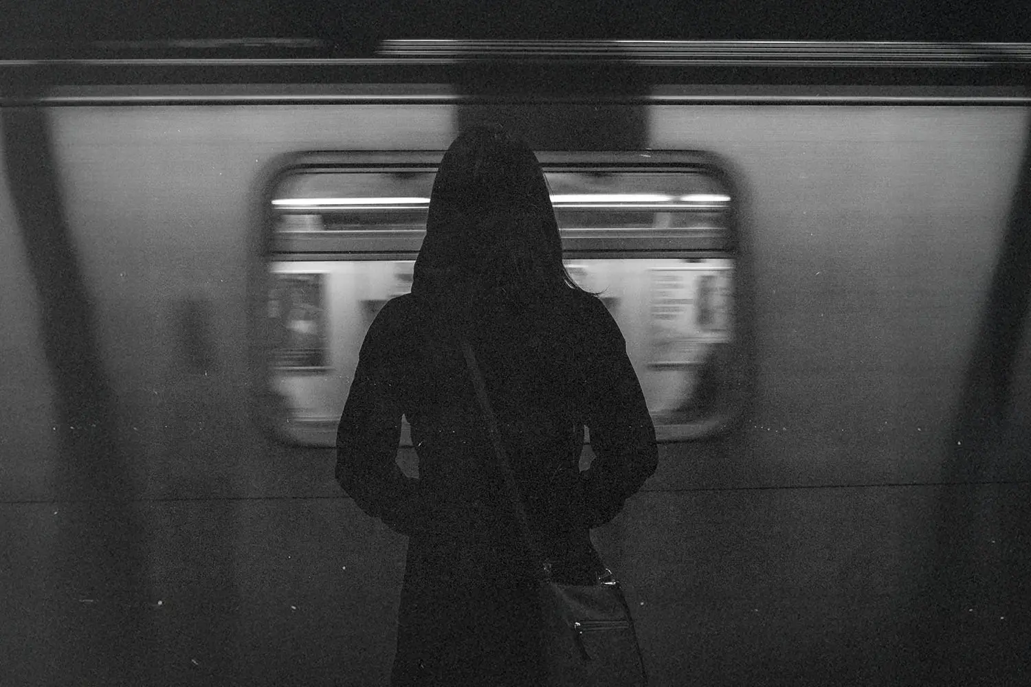 woman standing in subway car