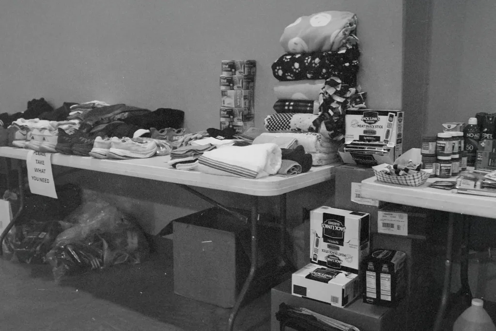 20250805-KCM-Disaster-Relief-Team-Continues-to-Work-in-Kerr - KCM Blog black and white photo of donations on a table