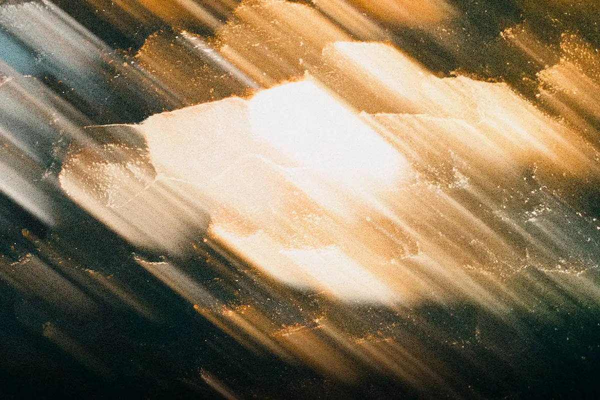 Abstract golden and white streaks of light symbolize God’s power to restore life and bring hope to broken things, reflecting healing, renewal, and spiritual victory.