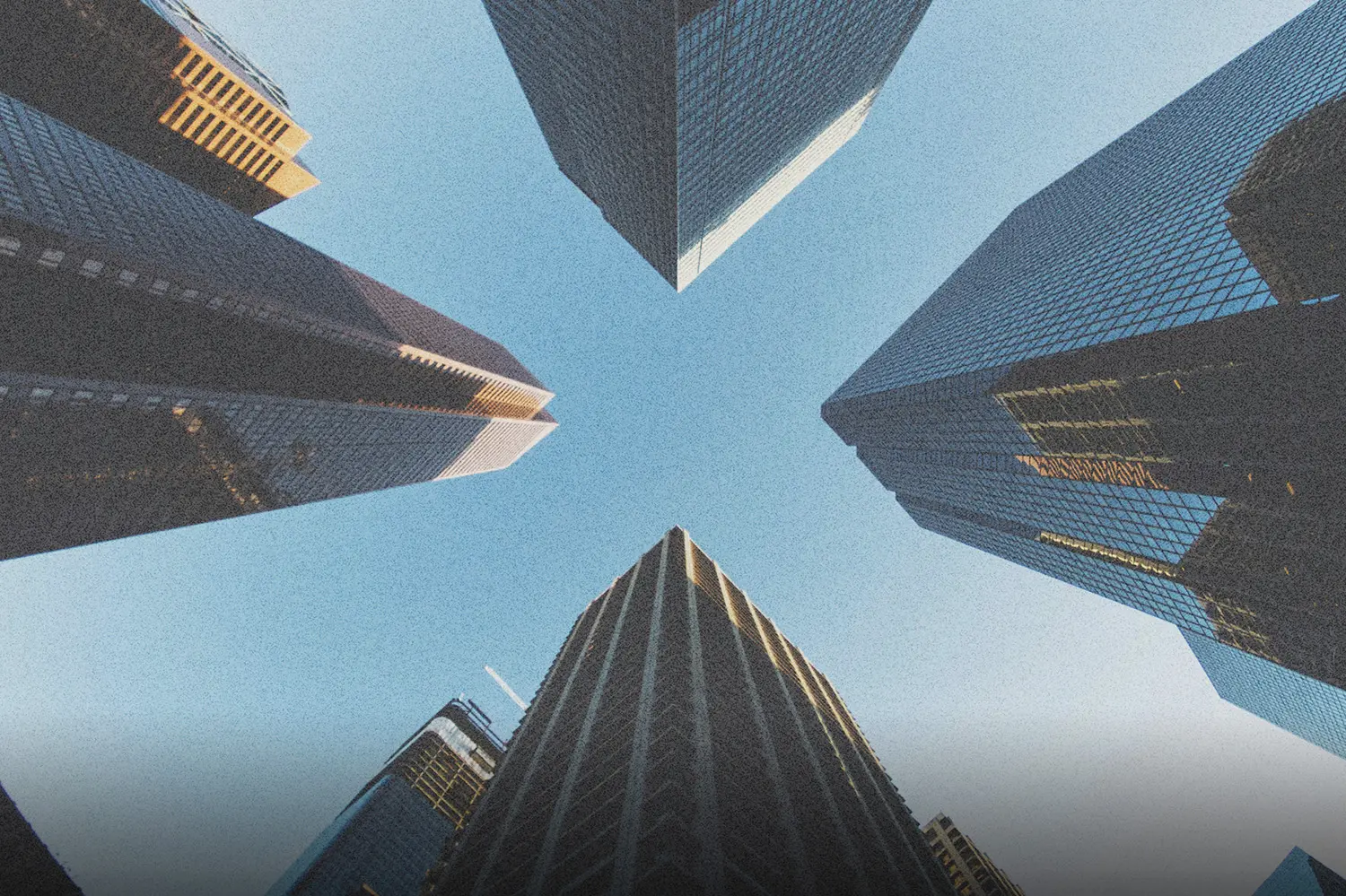 Looking up at towering buildings symbolizing God’s path to financial provision, reflecting spiritual alignment, growth, and trusting God as the source of increase